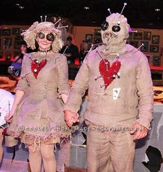 two people dressed in costumes standing next to each other