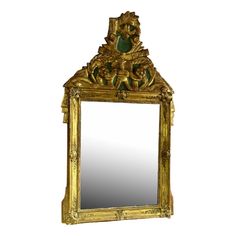 an ornate gold framed mirror on a white background, with green and yellow decorations around the edges