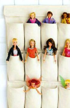 the barbie dolls are lined up in their beddings to be made into pillows