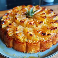 a pineapple upside down cake on a blue plate