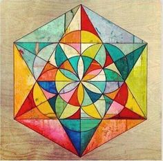 an image of a colorful geometric design on wood