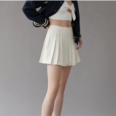 Elevate Your Casual Wardrobe With This Urban Outfitters Linen Pleated Mini Skirt In Ivory. The Skirt Features A Solid Pattern And A Zip Closure For A Minimalist And Collegiate Look. Perfect For Summer, Fall, And Spring, This Skirt Is Made Of A Linen Blend Material That Is Machine Washable For Easy Care. The Skirt Has A Short Length And A Pleated Design With No Pockets For A Streamlined And Preppy Look. It Is A Size Small And Fits Regular Size Types. This Skirt Is Ideal For Casual Occasions And C Spring Solid Color Mini Hem Bottoms, Beige Solid Color Pleated Skirt For Summer, Trendy Beige Pleated Skirt For Spring, Beige Pleated Skirt For Spring, Beige Solid Color Pleated Skirt For Spring, Beige Mini Pleated Skirt For Summer, Beige Pleated Tennis Skirt For Summer, White Solid Color Mini Skirt For Spring, Solid Color Mini Tennis Skirt For Spring