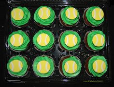 cupcakes with green and yellow frosting in a tray