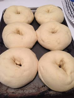 six doughnuts sitting on top of a baking pan