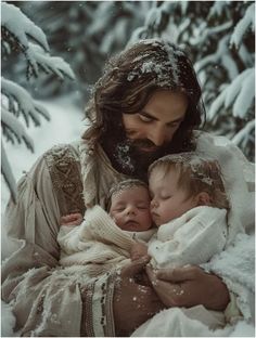 a woman holding two babies in her arms while she is covered in snow and surrounded by pine trees