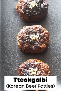 three small cookies are sitting on a black surface with the words teckgabi korean beef patties