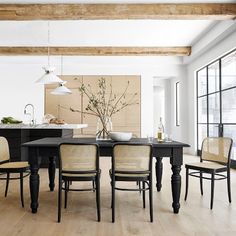 a dining room table with chairs around it