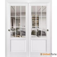 two white double doors with mirrored windows in the front and side panels on each door