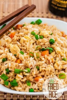 rice with peas and carrots in a white bowl