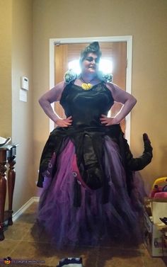 a woman in a black and purple costume