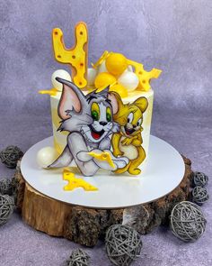 a cake decorated with cartoon characters on it