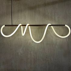 a white light hanging from the side of a wall