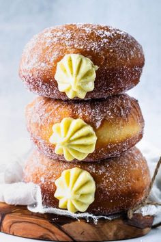 three donuts stacked on top of each other with icing