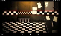 a black and white checkered floor in a dark room with notes on the wall