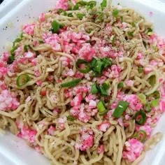 a white plate topped with pasta and veggies