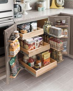 an organized pantry in the middle of a kitchen