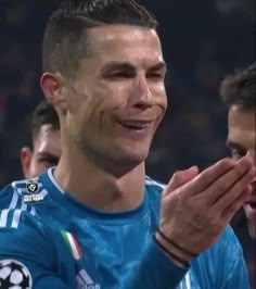 two soccer players are applauding each other