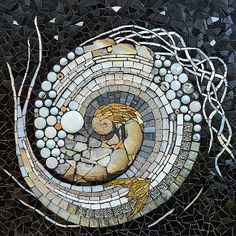 an artistic mosaic artwork depicting a woman in a circle surrounded by rocks and pebbles, on black background