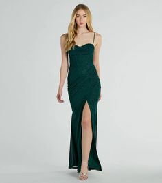 a woman in a long green dress