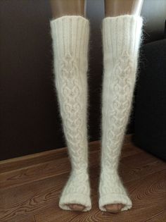 High socks are knitted from angora with the addition of nylon (for durability). Angora yarn is made from angora rabbit down, so the socks are very soft and delicate. These long socks are warm, cozy and fluffy. Look how These socks can be called stockings) You can wear them when doing household chores or when watching TV on the couch. You will look very impressive! Dress them in bed and you will be warm, soft and cozy. I knit with premium quality yarn. The fingerless socks are suitable for yoga d Winter White Knee-high Stockings, White Knee-high Winter Stockings, White Warm Knee-high Socks, Warm White Knee-high Socks, Comfortable Warm White Knee-high Socks, Soft White Knee-high Socks For Winter, White Knee-high Comfortable Leg Warmers, Comfortable White Knee-high Leg Warmers, Cozy Thick White Socks