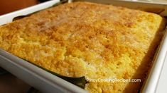 a casserole in a white dish with green peppers