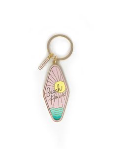 a keychain with the words beach please on it and an image of a surfboard