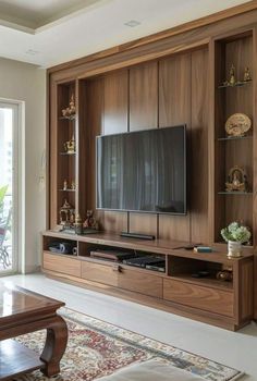 a living room with a large entertainment center