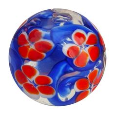 a glass ball with red and blue flowers on it