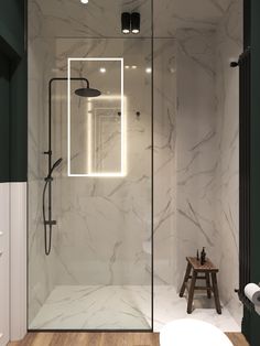 a walk in shower sitting next to a wooden stool