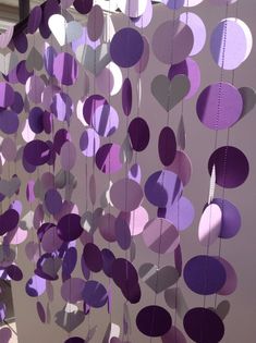 purple and white paper circles hanging from strings