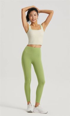 This tank top, made with 80% Nylon and 20% Spandex, is an embodiment of our brand's mission to harmonize yoga, meditation, and energy healing. Designed for everyday loungewear, its contemporary fit is perfect for the spring/summer season. The molded cup feature adds a touch of elegance, making this top a perfect blend of comfort and style. Enjoy the ease of machine wash care instructions. Celebrate your unique journey with this versatile piece from our collection. Green Tank Top With Built-in Bra For Yoga, Compression Tank Top With Built-in Bra For Yoga, Fitted Athleisure Tank Top For Yoga, Seamless Compression Tank Top For Yoga, Seamless Compression Yoga Tank Top, Casual Compressive Activewear For Relaxation, Fitted Tank Top For Yoga, Fitted Tank Activewear For Yoga, Versatile Green Activewear For Loungewear