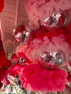 pink and red decorations hanging from the ceiling