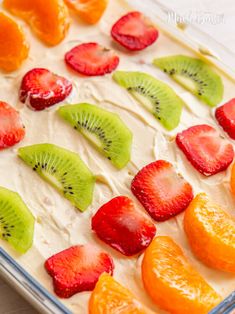 fruit arranged in the shape of kiwis and oranges on top of ice cream