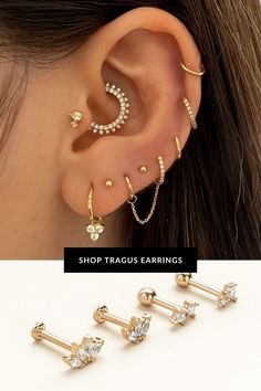 three pairs of ear piercings with crystal stones