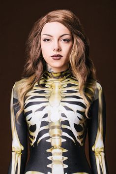 Women’s Halloween Costume Badinka. This piece is made from a high quality stretchy and breathable Lycra fabric that feels exquisite on the skin. It’s printed with outstanding graphics that react to UV light, so you can literally glow. High quality stretchy and sturdy elastic material that makes you feel comfortable and sexy. 

 
 Mock Neckline 
 Robust and Hidden Back Zipper Closure 
 Long Sleeves 
 UV Black Light Reactive 
 82% Polyester 18% Elastane 
 Non-Transparent Italian Lycra 
 30° Cold Wash, Hang dry 
 


 Halloween Costume Women, Sexy Halloween Costume, Adult Halloween Costume, Best Halloween Costumes 2022, Halloween Clothing, Form Fitting Full Bodysuit Halloween Promotion, Skeleton Costumes, Skeleton Bodysuit, Early Halloween, Halloween Promotions, Halloween Bodysuit, Women Skeleton, Bodysuit Costume, Womens Costumes