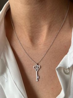 Get this stylish key to keep your high energy 🔑 Get this beautiful minimalist jewelry made with the quality of perfect elements✨ You can choose 925K Sterling Silver with the options of Gold, Rose Gold or White Gold colors. High quality jewelry for everyone 🤍  Details * 925K Sterling Silver Option → 14K Gold, Rose Gold or White Gold plated * Chain length is approximately 18 inches (16+2 in extender) / 45 cm (40+5 cm extender) * Time is everything! You will receive your package as soon as possible 🚚  * We care about the quality of metal to make sure it will last for a long time * We use enamel technique to color the jewelry and high quality zircons only * There can be tiny differences on each item. Length difference of the chain as well as color changes and shade differences of the stones Elegant Two Keys Necklace As Gift, Elegant Two Keys Necklace Gift, Elegant Two Keys Necklace For Gift, Elegant Sterling Silver Key Jewelry, Elegant Sterling Silver Key Necklace, Elegant Heart-shaped Key Jewelry, Time Is Everything, Lock Necklace, Love Jewelry