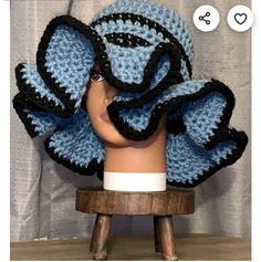 a crocheted hat on top of a wooden stool