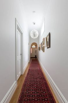 the hallway is clean and ready for us to use as an entrance way in this home