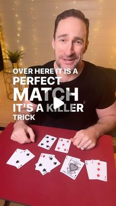 a man sitting at a table with cards in front of him and the words over here is a perfect match it's a killer trick