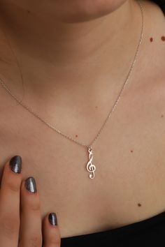 This cute 925 sterling silver necklace is a must for every woman. Can be worn alone, or layered with other necklaces for a trendier look. This silver animal necklace comes in a beautiful box, gift-ready!  ❤️ It would be an amazing gift for Anniversary, Birthdays, Christmas, Mother's Day, Women's Day. FEATURES - Material: High Quality Solid 925 Sterling Silver - Pendant height: 2.2 cm - Pendant width: 0.7 cm - Color Options: Silver, Yellow Gold, Rose Gold - Chain length 16 inches, 18 inches or 20 inches ❤️Production Techniques: Handmade and Laser Cutting (for High Quality) PACKING ❤️ All products are ready to be sent to you in stylish gift boxes. Also, there is no need for gift wrapping. SHIPPING AND RETURN - Production is made according to the order and delivered to the cargo next day. - S Sterling Silver Music-themed Pendant Necklace, Music-themed Sterling Silver Pendant Necklace, Music-themed Sterling Silver Necklace, Nickel-free Sterling Silver Music-themed Necklace, Silver Sterling Music-themed Necklace, Music-themed Silver Pendant Necklace, Nickel-free Silver Music-themed Necklaces, Silver Music-themed Necklace For Gift, Music Note Jewelry