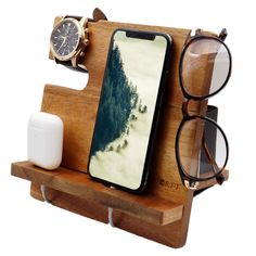 a wooden stand with glasses and an iphone on it