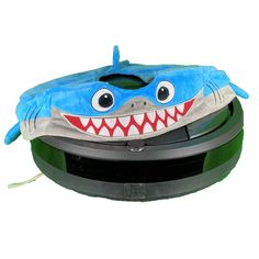 an inflatable toy with a shark head on it's back and mouth