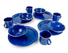 a set of blue dishes and cups on a white background