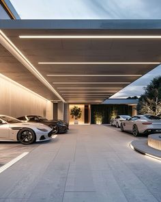 several luxury cars parked in front of a building