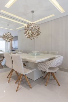 the instagram page shows an image of a dining room with white chairs and chandelier