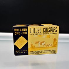 two boxes of cheese crispies sitting on top of a white table next to each other