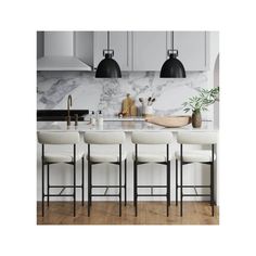 an image of a kitchen setting with stools and marble counter tops on the island