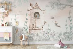 a child's room decorated in pastel colors with a fairy castle wallpaper