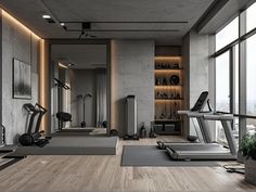 a gym with treadmills, exercise equipment and windows looking out onto the city