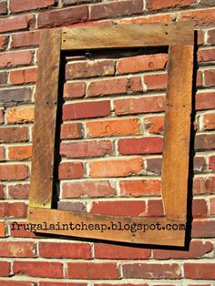 a brick wall with a wooden frame on it